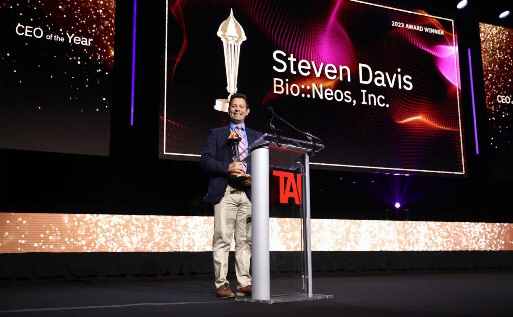 Steve Davis on stage smiling at the Prometheus Awards accepting the 2023 CEO of the Year award.