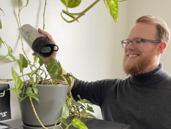 Kody watering our over 20 year old plant