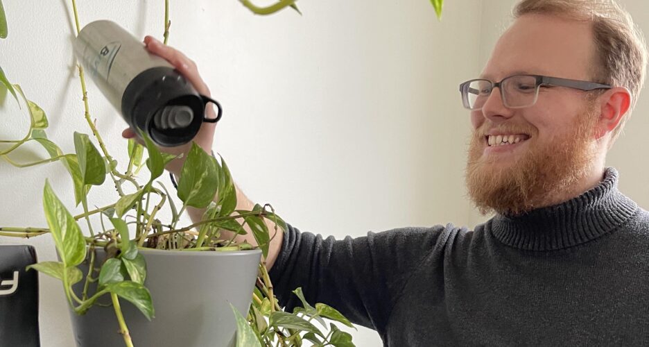 Kody watering our over 20 year old plant